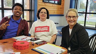 The state Ethics Commission is investigating how Go Forward Pine Bluff paid for and reported its efforts to get college students to the polls during a sales tax campaign in November. Shown here are Go Forward representatives Ky'Lik Rich (left), an intern; Leigh Cockrum, office manager and human resources adviser with Go Forward; and Rosalind Mouser, board member and chairwoman of communications and marketing for the campaign committee. (Pine Bluff Commercial/I.C. Murrell)